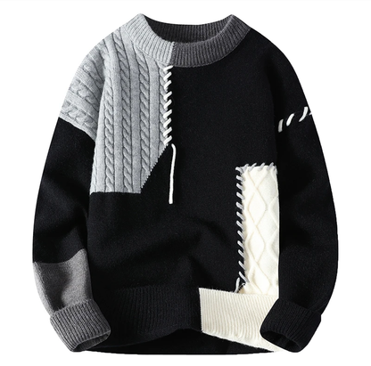 Schwarzer Patchwork-Strickpullover mit grauen und cremefarbenen Zopfmuster-Flächen