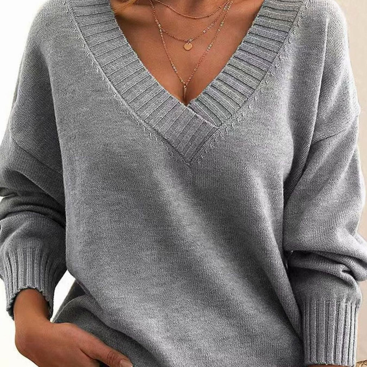 Grauer Oversize-Pullover mit V-Ausschnitt für Damen